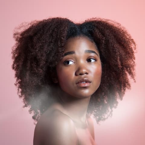 A melanin lady on afro hair.